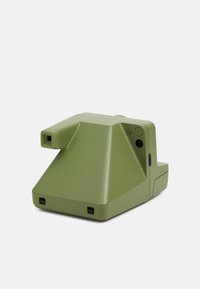 Compact instant camera in matte olive green with a geometric design, featuring a lens, power button, and USB-C port.
