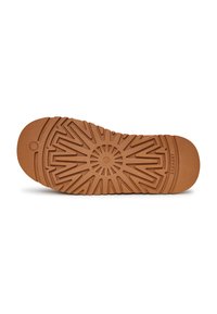 Semelle de chaussure en caoutchouc marron avec un motif de texture comprenant un design en rayons de soleil et des rainures pour l'adhérence. Présente le nom de la marque sur le côté.