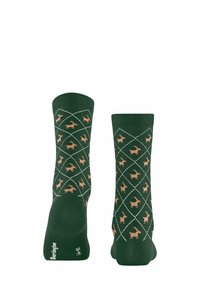 Chaussettes vertes ornées d'un motif en losanges avec des silhouettes de cerf brun clair, finies par un bord côtelé et des sections de orteil et de talon unies.