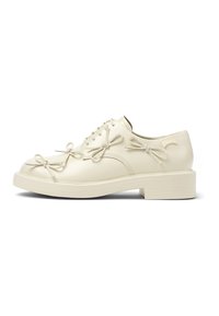 Scarpe lace-up in pelle crema con fiocchi decorativi sulla parte superiore e suola di gomma spessa, caratterizzate da una finitura liscia e punta arrotondata.