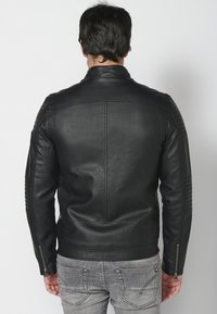 Koroshi SKIN EFFECT - Giacca in similpelle - black