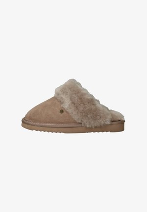 Beige suede slipper with a fluffy shearling strap, rounded toe, and textured sole. Features subtle branding on the side.