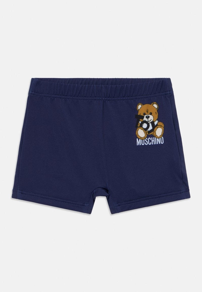 Bañador navy con cinturilla elástica, que presenta un gráfico de un oso y el texto "MUSCHINU" en la parte frontal. Fabricado con un material suave y flexible.