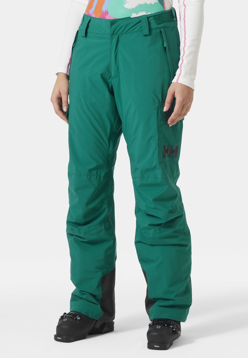 Grüne wasserdichte Schneehosen mit lockerer Passform, mit Reißverschlusstaschen an der Seite und schwarzen Akzenten an den Bündchen. Mit einem Logo an der Oberschenkel.