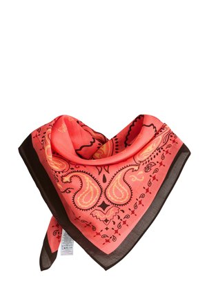 Coral bandana with black border featuring yellow paisley and floral patterns, displayed folded with visible care tag.
