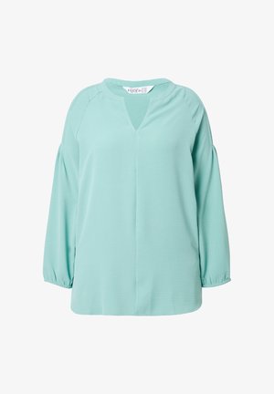 MintgrüBluse mit V-Ausschnitt, Raglanärmeln und gerafften Manschetten. Hergestellt aus weichem Stoff mit glatter Textur und minimalistischer Gestaltung.