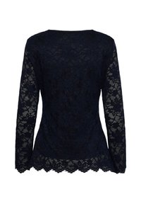 Blouse noire en dentelle à manches longues avec motifs floraux et ourlet festonné, vue de dos.
