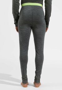 Graue Leggings mit glatter Textur, ausgestattet mit einem hellgrünen elastischen Bund, der mit "obde" versehen ist. Knöchellanges Design.