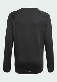 Czarna długorękawowa koszulka sportowa o gładkiej teksturze, okrągłym dekolcie, rękawach raglanowych i logotypie AEROREADY na dolnej części pleców.