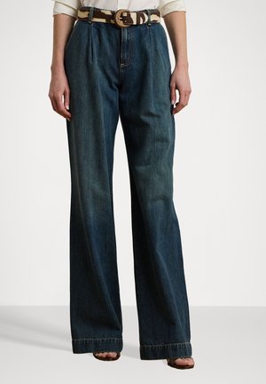 Wide-leg denim pants in dark blue, featuring a high waist and subtle front pleats, paired with a patterned belt and visible stitching details.