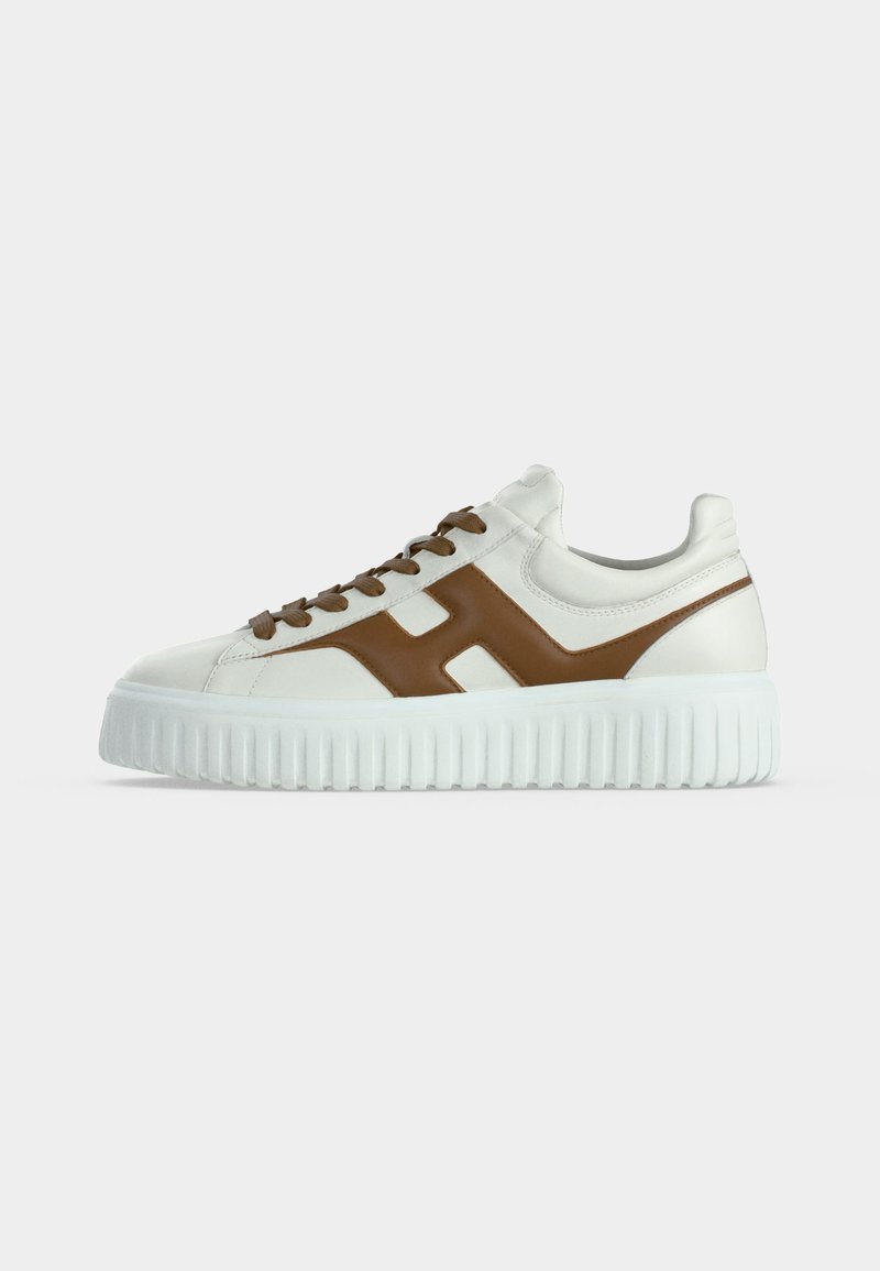 White sneaker with thick sole, brown "H" design on side, and brown laces, shown in side profile on a plain background.