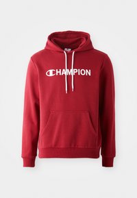 Roter Baumwoll-Hoodie mit Kängurutasche, weißen Kordeln und einem auffälligen weißen "CHAMPION"-Logo auf der Brust.