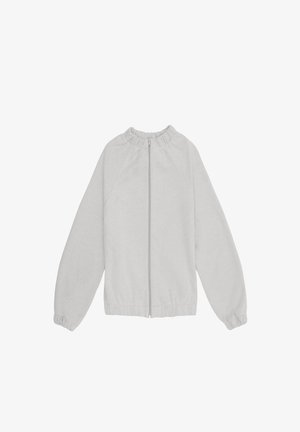 Jasnoszara kurtka z zamkiem błyskawicznym, z elastycznymi mankietami i kołnierzem, długimi rękawami oraz gładkim, jednolitym materiałem.