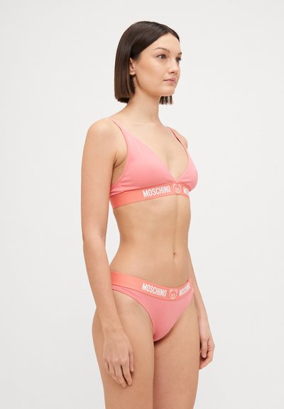 Pink bikini set featuring a triangular bralette and low-rise briefs. Material appears smooth with a branded elastic band.