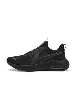 Chaussures de sport noires avec tige en maille, détails texturés et col rembourré. Dotées d'un logo proéminent et d'une semelle rembourrée avec unité d'air.