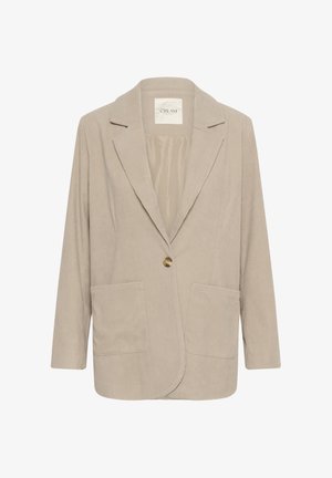 Bežs korduroja žakets ar iegrieztu atlokiem, vienu zeltītu pogu, divām priekšējām kabatām un garām piedurknēm. Gluda iekšējā oderes apdare.