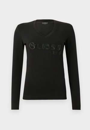 Svart langermet T-skjorte med V-hals og hevet "Guess" logo samt etablert år 1981, med en glatt tekstur og tettsittende design.