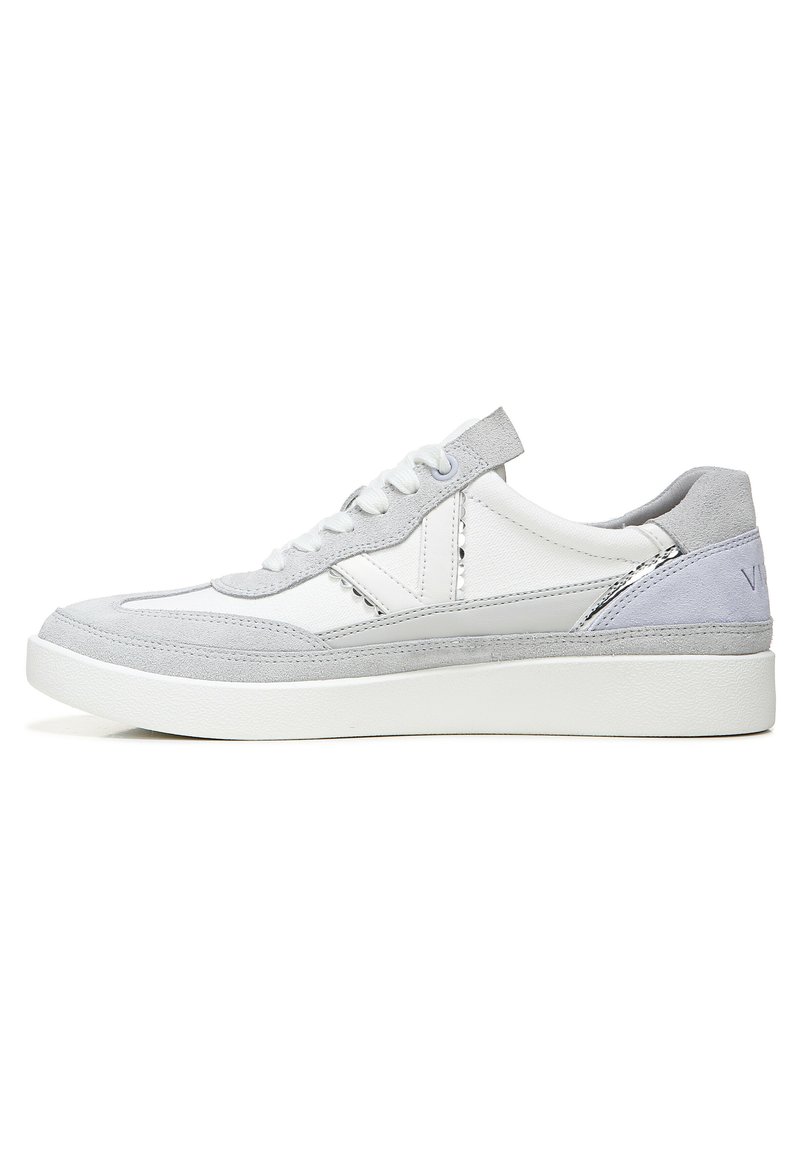 White and light gray sneaker with suede and leather materials, round toe, flat sole, and lace-up design. Features textured accents.