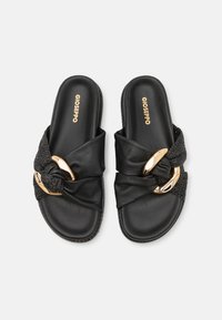 Black slide sandals with a textured knotted strap and gold-toned hardware accents. Soft leather upper and patterned textile detail.