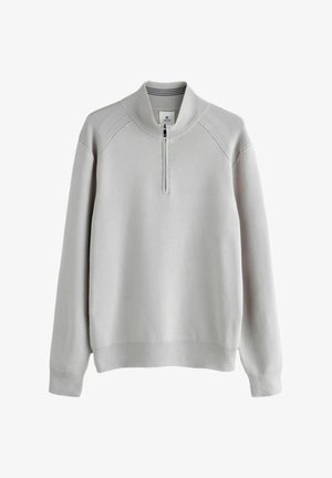 Hellgrauer Pullover mit Reißverschluss am Hals, geripptem Kragen und Bündchen sowie Raglanschultern. Glatte Textur mit einfachem, klaren Design.