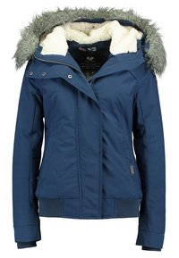 Veste d'hiver bleu marine avec capuche bordée de fourrure et intérieur en polaire blanche, poignets côtelés, fermeture éclair à l'avant et poches latérales.