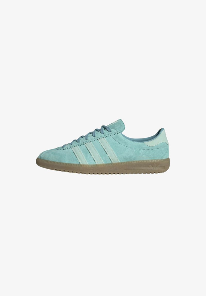 Blue suede sneaker with light blue accents and three white stripes. Features a rounded toe and a textured rubber sole.