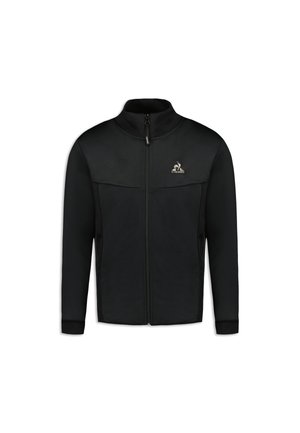 Black zip-up jacket with a high collar, featuring mesh sides and a logo on the chest. Smooth fabric with relaxed fit and ribbed cuffs.