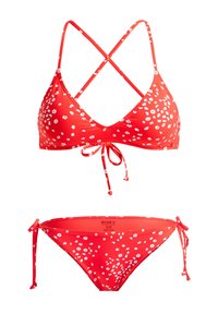 Red bikini set featuring a triangular top with white floral print, cross-back straps, and a tie at the center; matching adjustable bikini bottom.