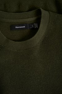Olive green textured knit sweater with a ribbed crew neck. Label reads "Matinique" and size "L." Flat layout reveals fabric detail.