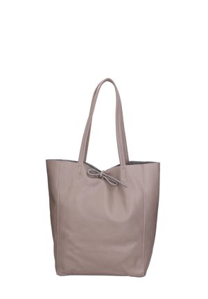 Leather tote bag in light taupe with a textured surface, features two shoulder straps and a bow detail at the top.