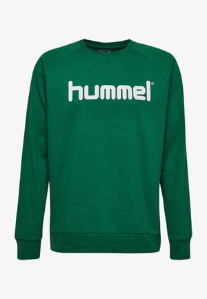 Felpa verde realizzata in misto cotone, con collo a giro e maniche raglan. Grande logo "hummel" bianco stampato sul davanti.