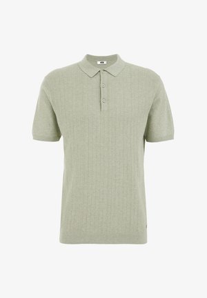 Koszulka polo w jasnozielonym kolorze z wypukłą fakturą, z zapięciem na trzy guziki i krótkimi rękawami. Miękka tkanina z delikatnym wzorem.