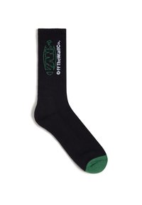 Schwarze Socken mit gerippter Textur, grünen Akzenten am Bund und an der Zehe sowie weißem Branding "VANS OffTheWall Co." an der Seite.