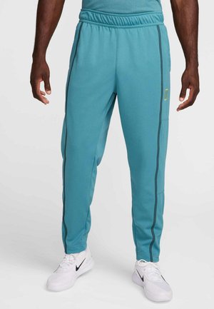 NIKECOURT HERITAGE SUIT PANT - Calças de fato de treino - mineral teal faded spruce