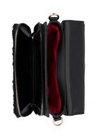 Black synthetic leather bag with red interior, two compartments separated by a zipper, and gold-tone hardware accents. Textured side panel.