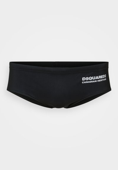 Schwarze Schwimmslips aus glattem Stoff. Mit einem Logo "DSQUARED2 CANADIAN HERITAGE" in weißem Druck auf der Vorderseite.