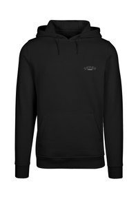 Sudadera negra de tejido suave con un bolsillo frontal y cordones. Diseño minimalista con "DEMON INSIDE" bordado en el pecho.