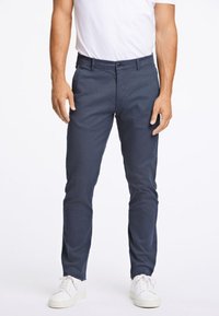 Men's navy chinos, slim fit, made of smooth cotton blend fabric, featuring a button closure, side pockets, and clean lines.