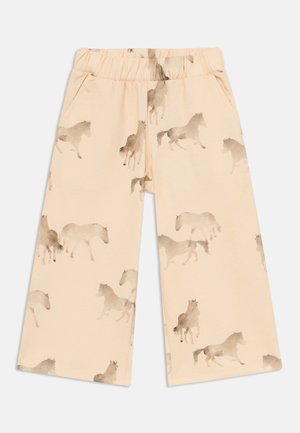 Jasnopomarańczowe bawełniane spodnie z nadrukiem konia w akwareli w różnych odcieniach brązu, z elastycznym paskiem w talii i szerokimi nogawkami.