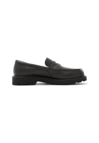 Svarta läderloafers med rund tå, centrerad remdetail och en texturerad gummisula. Rena linjer och minimalistisk design.