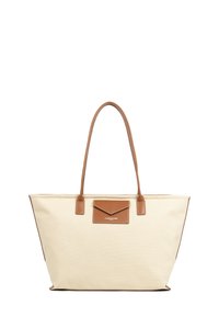 Borsa tote in canvas color avorio con accenti in pelle marrone. Presenta due manici lunghi e una tasca anteriore. Dettagli cuciti lungo i bordi.