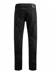 Jeans negros de corte ajustado, con cinco bolsillos, costuras visibles y un parche de cuero en la cinturilla en la parte trasera.