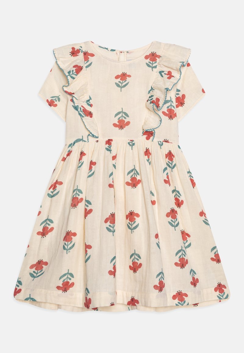Robe courte à manches courtes couleur crème avec imprimé floral rouge et vert, présentant des panneaux avant à volants avec un bord bleu.