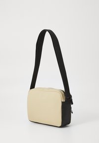 Tommy Jeans DAILY CAMERA BAG - Cross body bag - beige