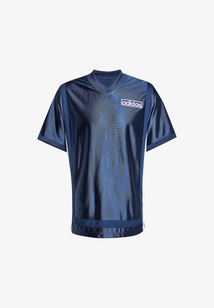 Tummansininen urheilupaita, jossa on lyhyet hihat, v-mallinen kaula-aukko ja valkoisia yksityiskohtia. Edessä vasemmalla puolella on Adidas-logo. Kankaan pinta on sileä.