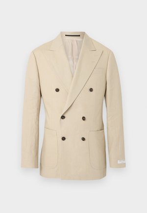 Beige színű, kétsoros férfi blézer hat sötét gombbal, csúcsos hajtókával, két első foltzsebbel és egy kis címkével az ujjon.