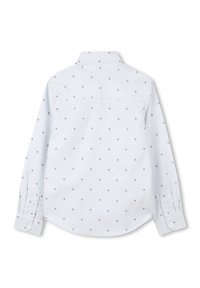 Camicia a maniche lunghe azzurro chiaro con motivo a pois grigi. Colletto e polsini con chiusure a bottone. Tessuto di cotone liscio.