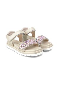 Beige sandals with wide straps, adjustable velcro closure, and a decorative band of iridescent rhinestones across the front. White sole.