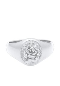 Bague en argent présentant une rose détaillée et un motif de feuille gravés sur une face ovale avec une bande lisse et polie.