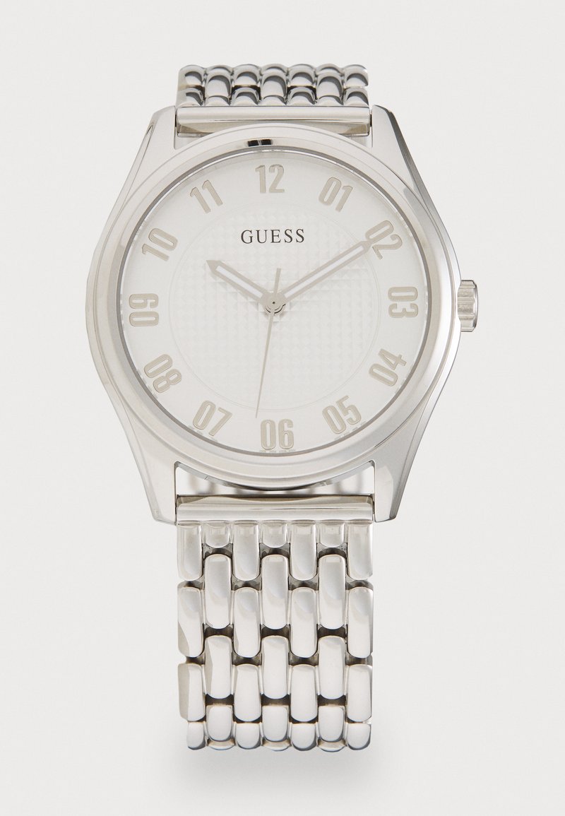 Silver stainless steel watch with a round face, white dial, embossed texture, large numeral markers, and a linked bracelet strap.